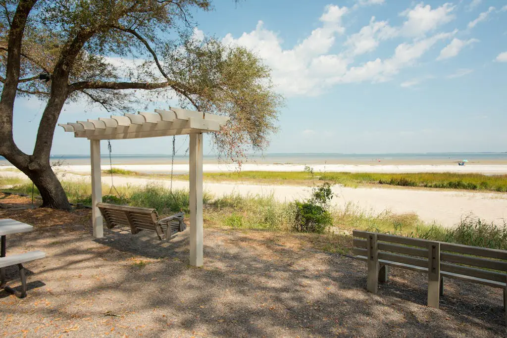 3rd-floor condo with water views, balcony, pools, gym, & beach access