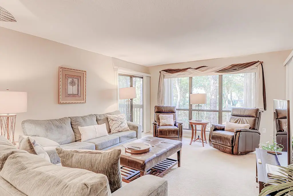 Dog-friendly condo with pool, central AC, & washer/dryer - quick walk to beach