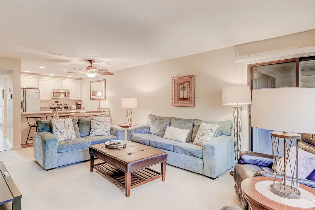 Dog-friendly condo with pool, central AC, & washer/dryer - quick walk to beach
