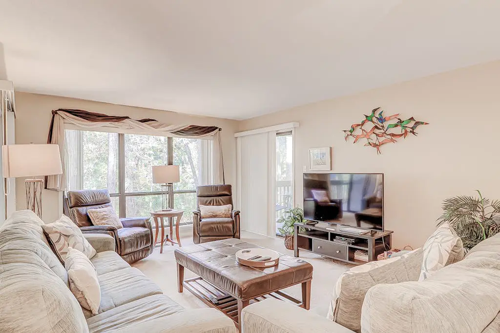 Dog-friendly condo with pool, central AC, & washer/dryer - quick walk to beach