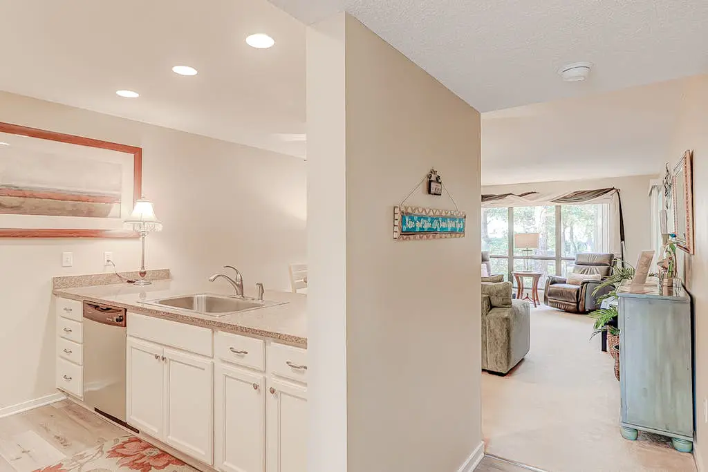Dog-friendly condo with pool, central AC, & washer/dryer - quick walk to beach