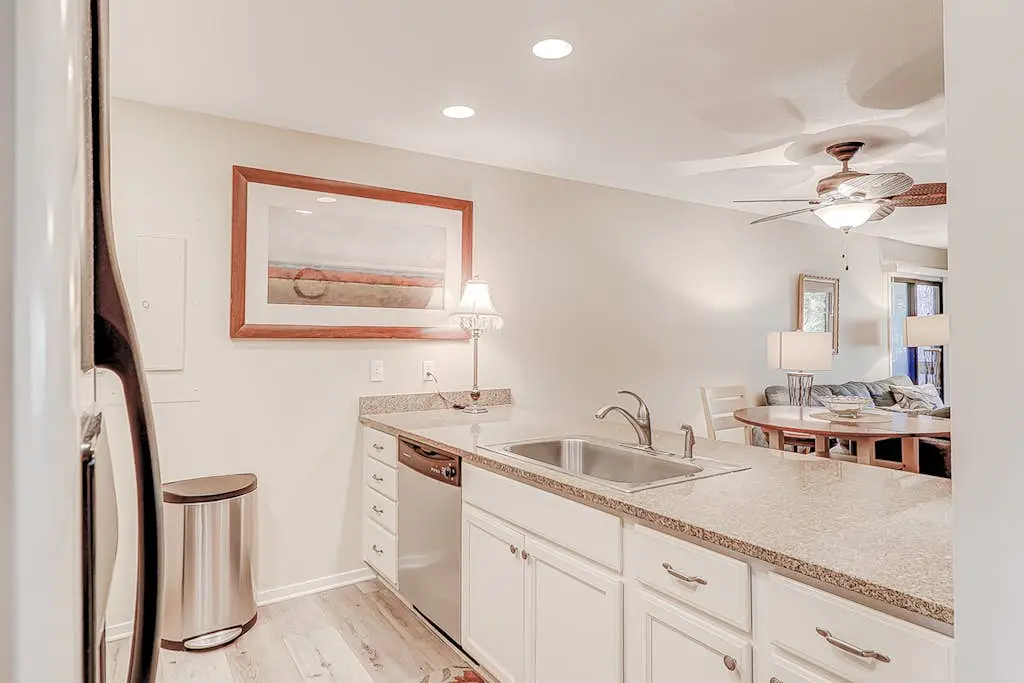 Dog-friendly condo with pool, central AC, & washer/dryer - quick walk to beach