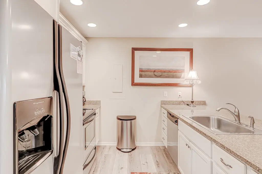 Dog-friendly condo with pool, central AC, & washer/dryer - quick walk to beach
