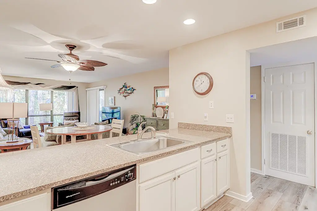 Dog-friendly condo with pool, central AC, & washer/dryer - quick walk to beach