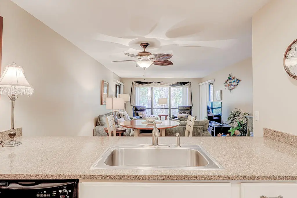 Dog-friendly condo with pool, central AC, & washer/dryer - quick walk to beach