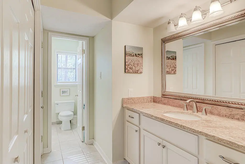 Dog-friendly condo with pool, central AC, & washer/dryer - quick walk to beach