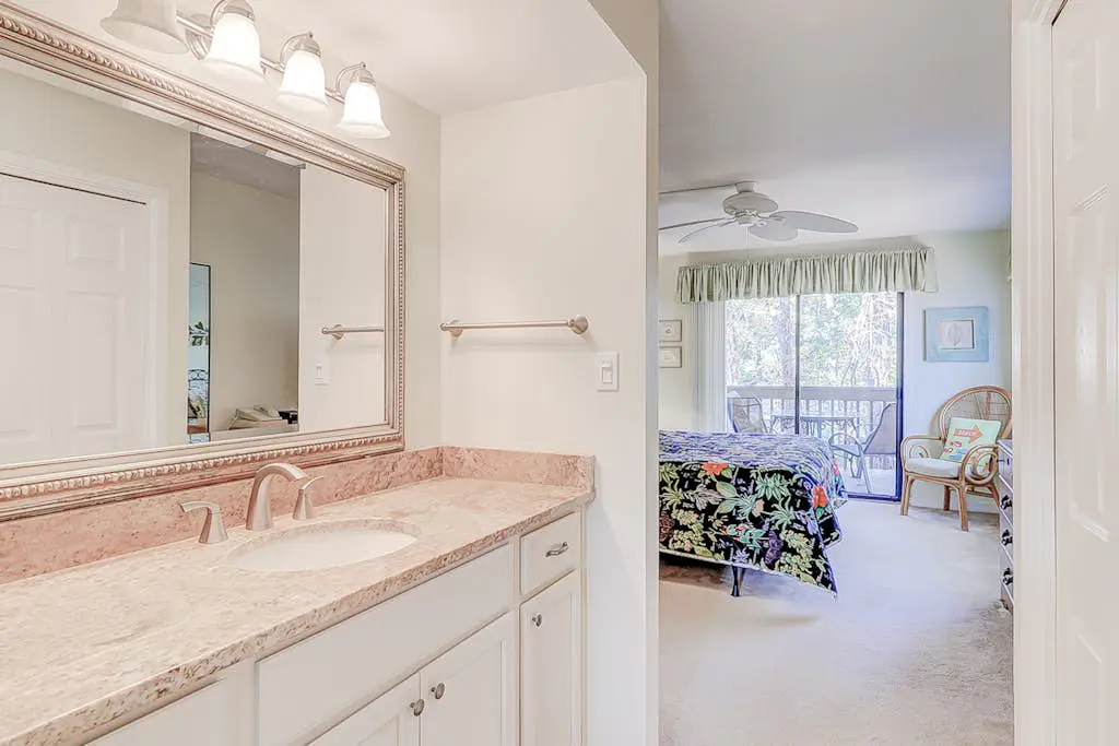 Dog-friendly condo with pool, central AC, & washer/dryer - quick walk to beach