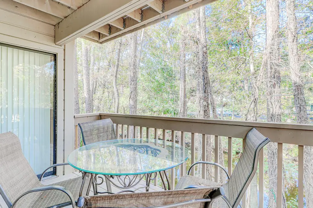 Dog-friendly condo with pool, central AC, & washer/dryer - quick walk to beach