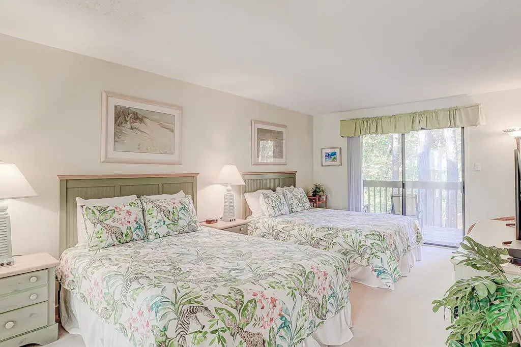 Dog-friendly condo with pool, central AC, & washer/dryer - quick walk to beach