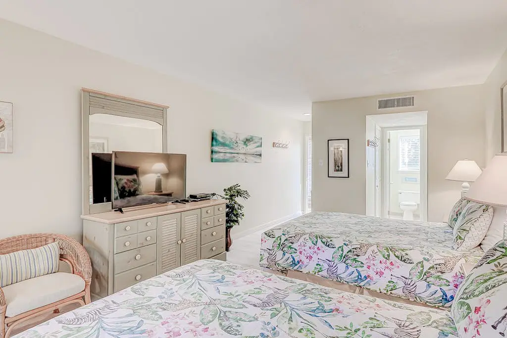 Dog-friendly condo with pool, central AC, & washer/dryer - quick walk to beach