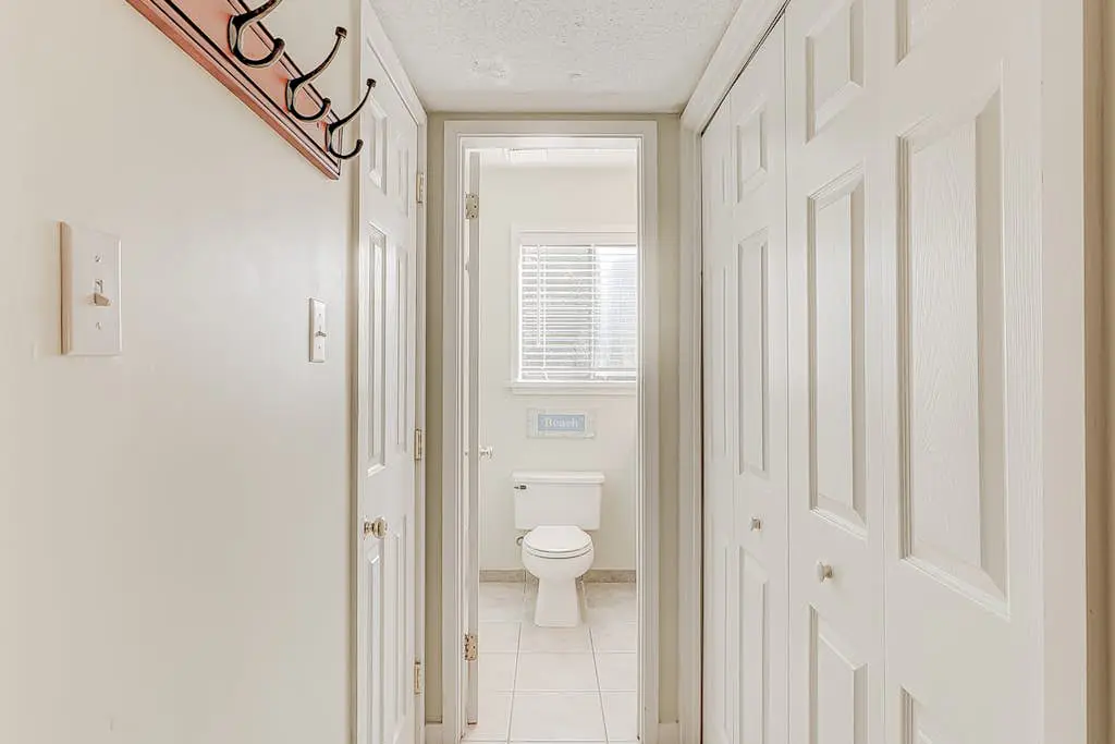 Dog-friendly condo with pool, central AC, & washer/dryer - quick walk to beach