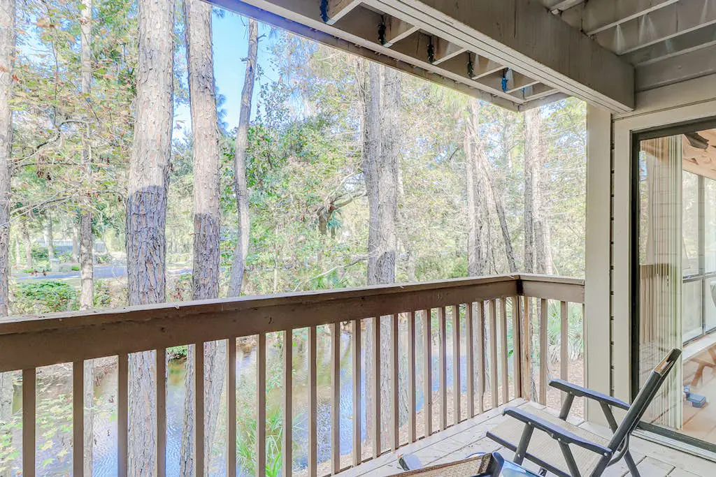 Dog-friendly condo with pool, central AC, & washer/dryer - quick walk to beach