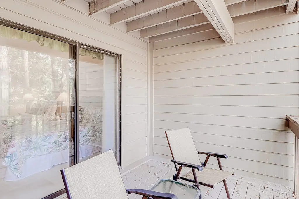 Dog-friendly condo with pool, central AC, & washer/dryer - quick walk to beach