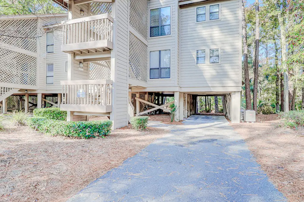 Dog-friendly condo with pool, central AC, & washer/dryer - quick walk to beach