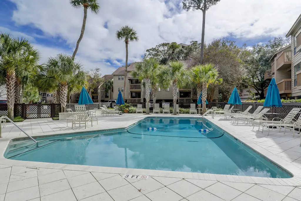Dog-friendly condo with pool, central AC, & washer/dryer - quick walk to beach