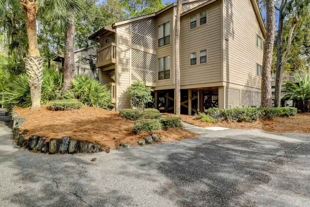 Dog-friendly condo with pool, central AC, & washer/dryer - quick walk to beach