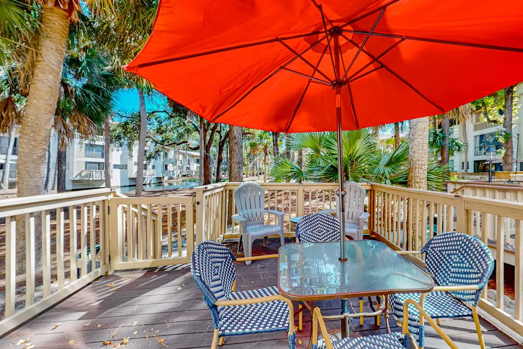 Beach access condo with deck, pool, washer/dryer, and AC - snowbird-friendly