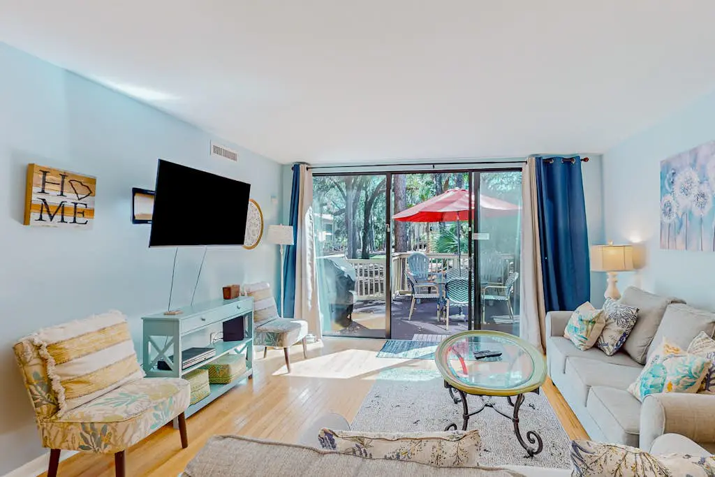 Beach access condo with deck, pool, washer/dryer, and AC - snowbird-friendly