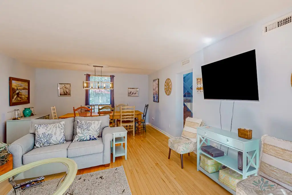 Beach access condo with deck, pool, washer/dryer, and AC - snowbird-friendly