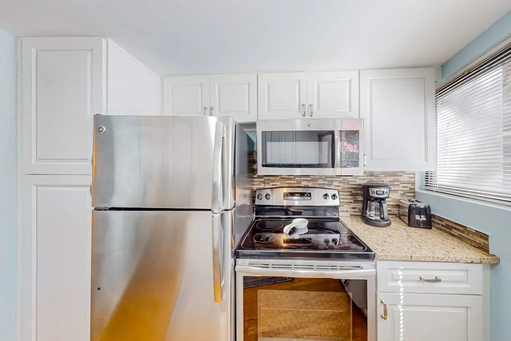 Beach access condo with deck, pool, washer/dryer, and AC - snowbird-friendly