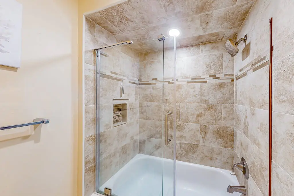 Beach access condo with deck, pool, washer/dryer, and AC - snowbird-friendly