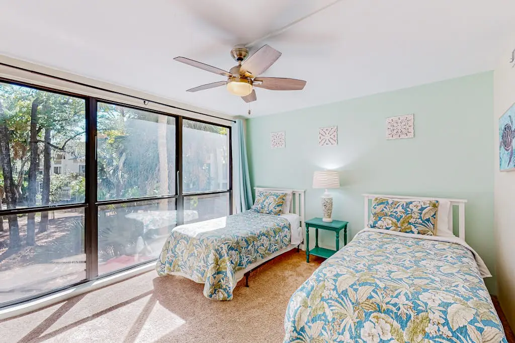 Beach access condo with deck, pool, washer/dryer, and AC - snowbird-friendly