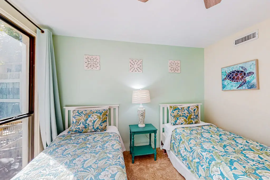 Beach access condo with deck, pool, washer/dryer, and AC - snowbird-friendly