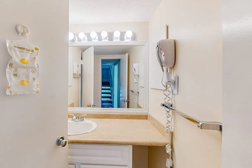 Beach access condo with deck, pool, washer/dryer, and AC - snowbird-friendly