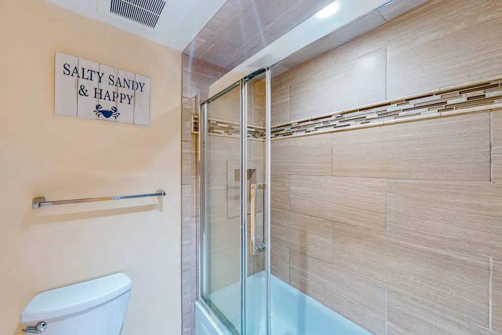 Beach access condo with deck, pool, washer/dryer, and AC - snowbird-friendly