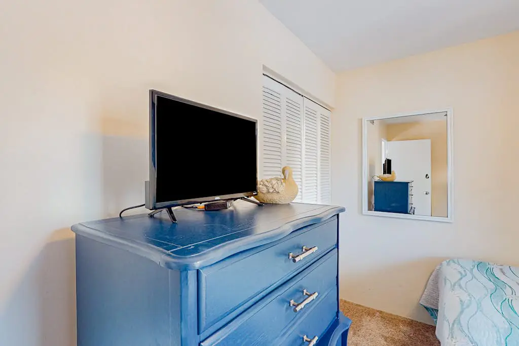 Beach access condo with deck, pool, washer/dryer, and AC - snowbird-friendly