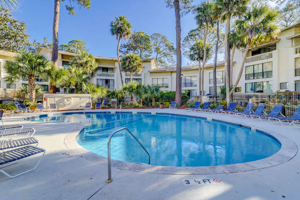 Beach access condo with deck, pool, washer/dryer, and AC - snowbird-friendly