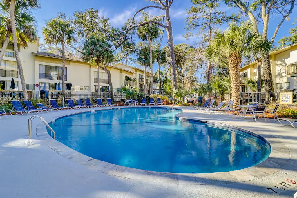 Beach access condo with deck, pool, washer/dryer, and AC - snowbird-friendly