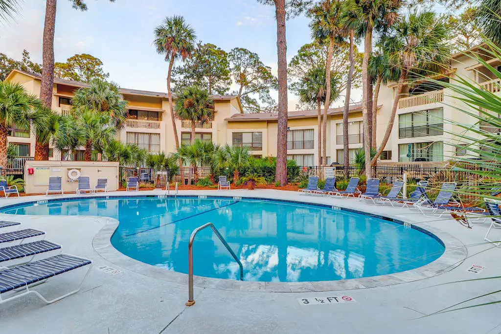 Beach access condo with deck, pool, washer/dryer, and AC - snowbird-friendly