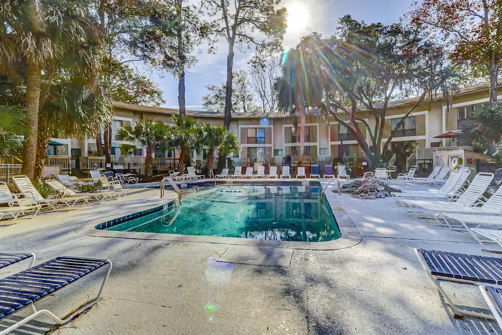 Beach access condo with deck, pool, washer/dryer, and AC - snowbird-friendly