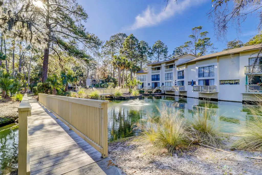 Beach access condo with deck, pool, washer/dryer, and AC - snowbird-friendly