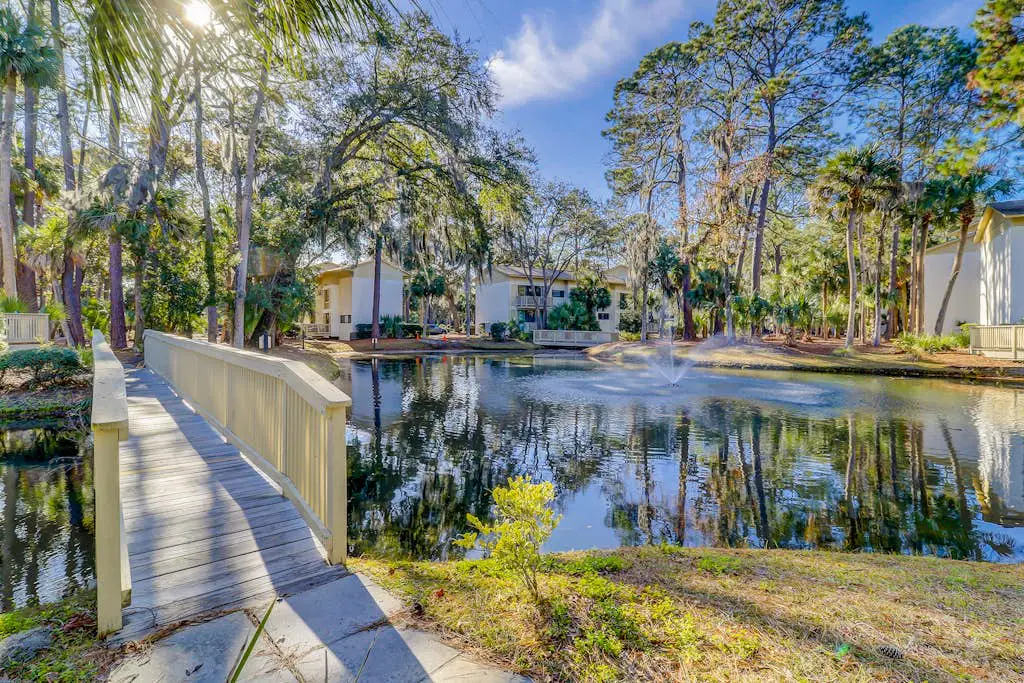 Beach access condo with deck, pool, washer/dryer, and AC - snowbird-friendly