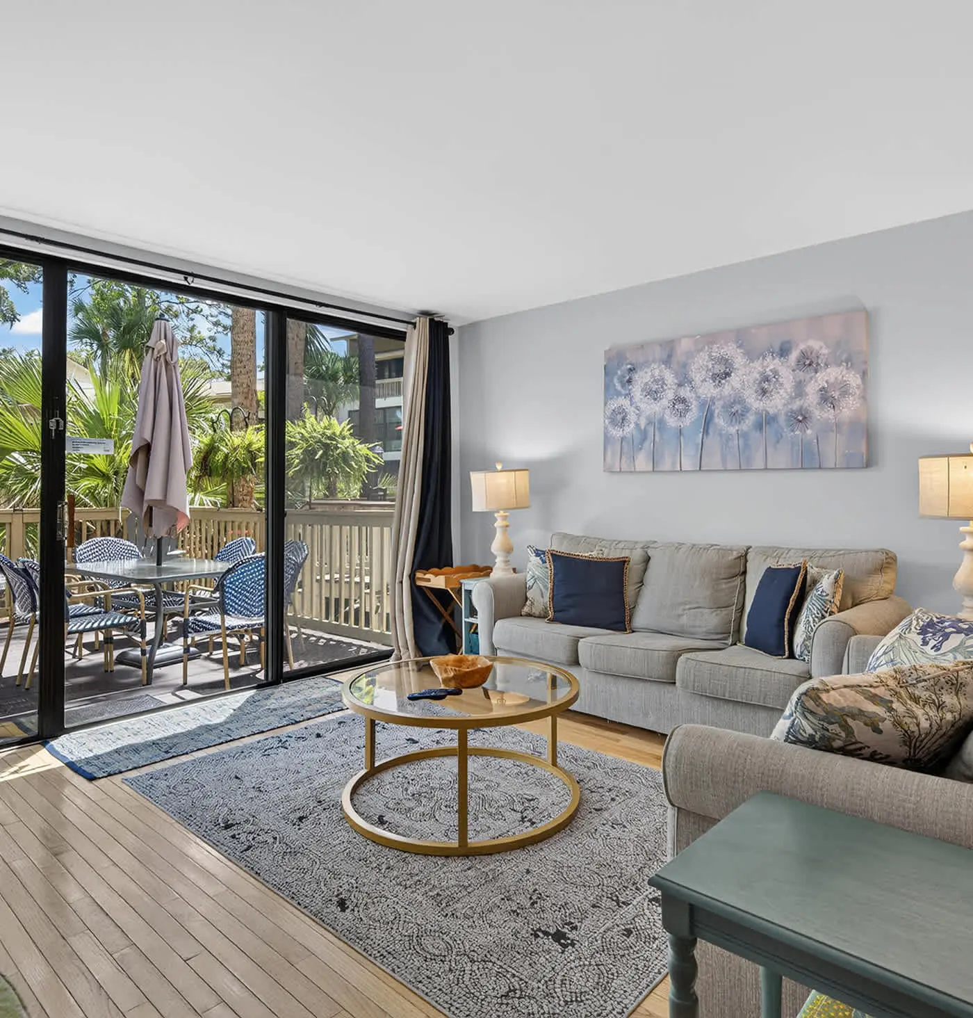 Beach access condo with deck, pool, washer dryer, and AC - snowbird-friendly