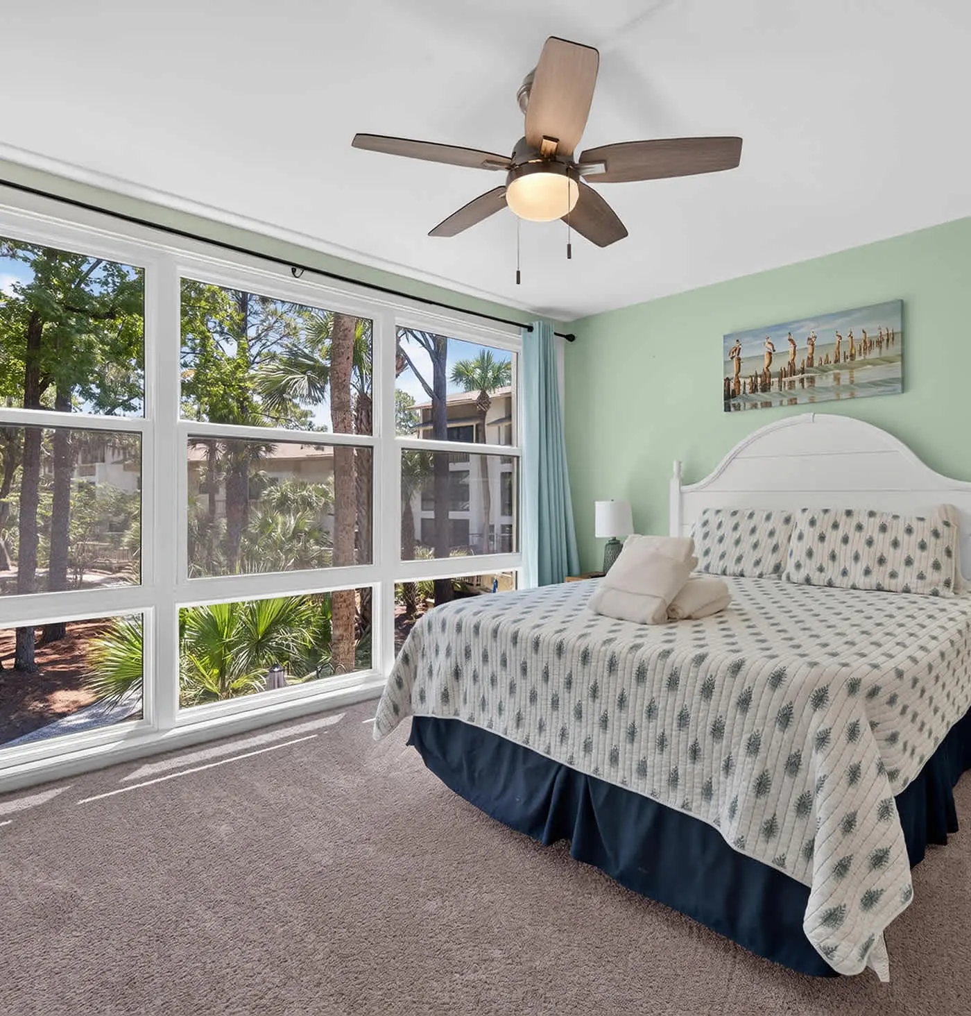 Beach access condo with deck, pool, washer dryer, and AC - snowbird-friendly