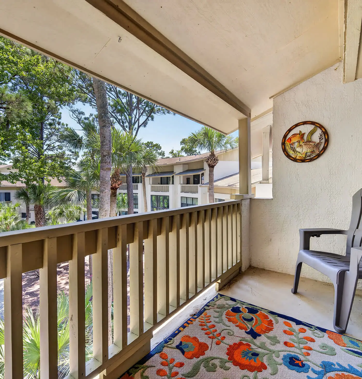 Beach access condo with deck, pool, washer dryer, and AC - snowbird-friendly
