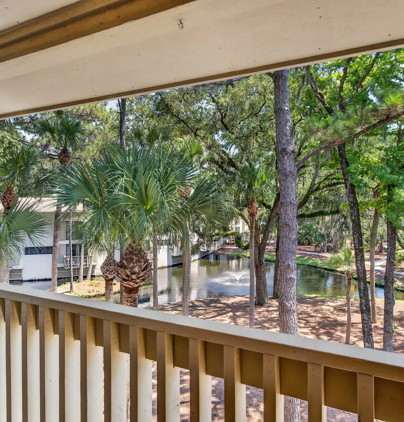 Beach access condo with deck, pool, washer dryer, and AC - snowbird-friendly