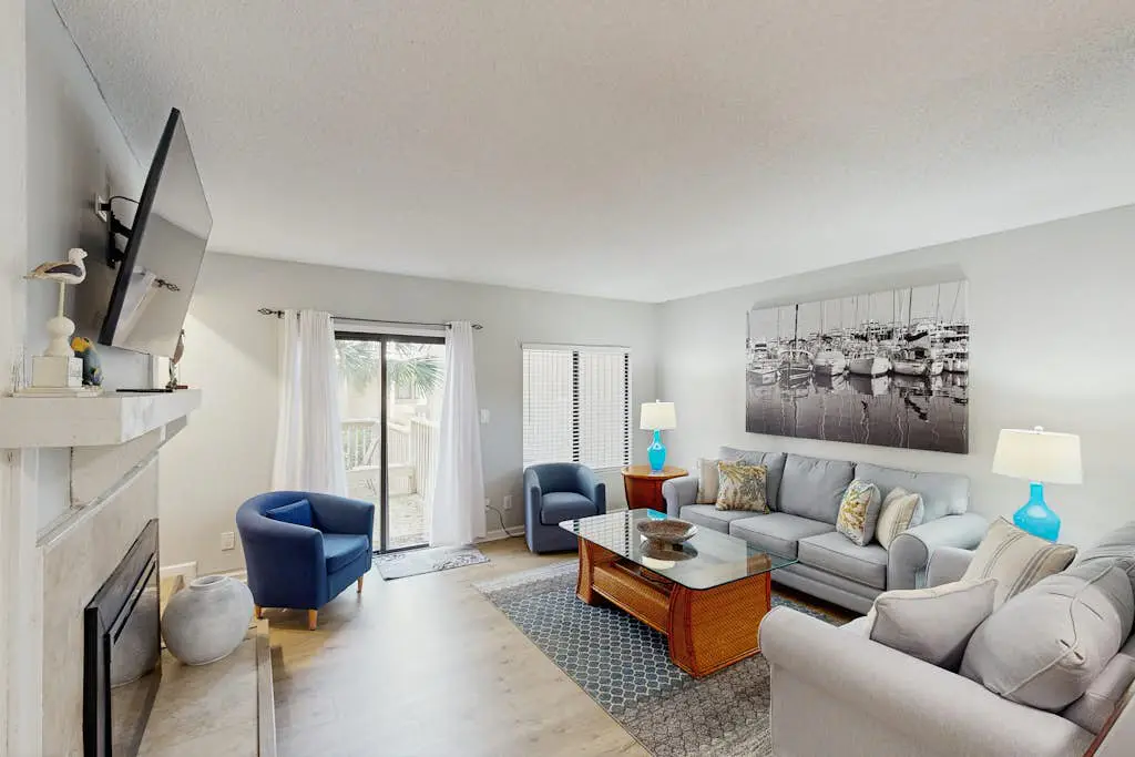 Sunny Villa with Spacious Decks, Al Fresco Dining, & Shared Pool - Nearby Beach Access