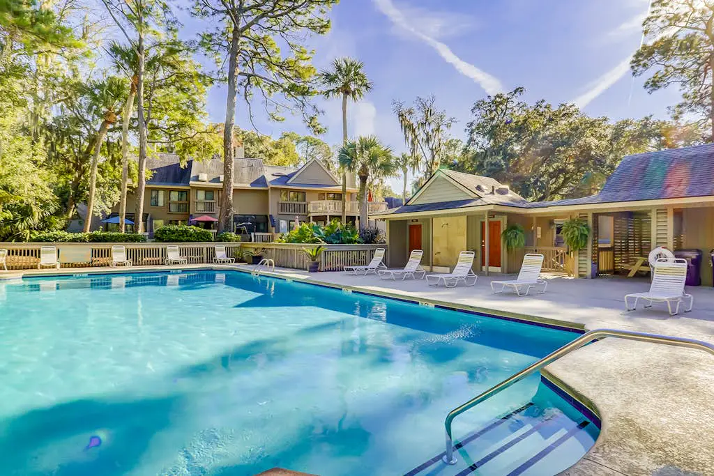 Sunny Villa with Spacious Decks, Al Fresco Dining, & Shared Pool - Nearby Beach Access