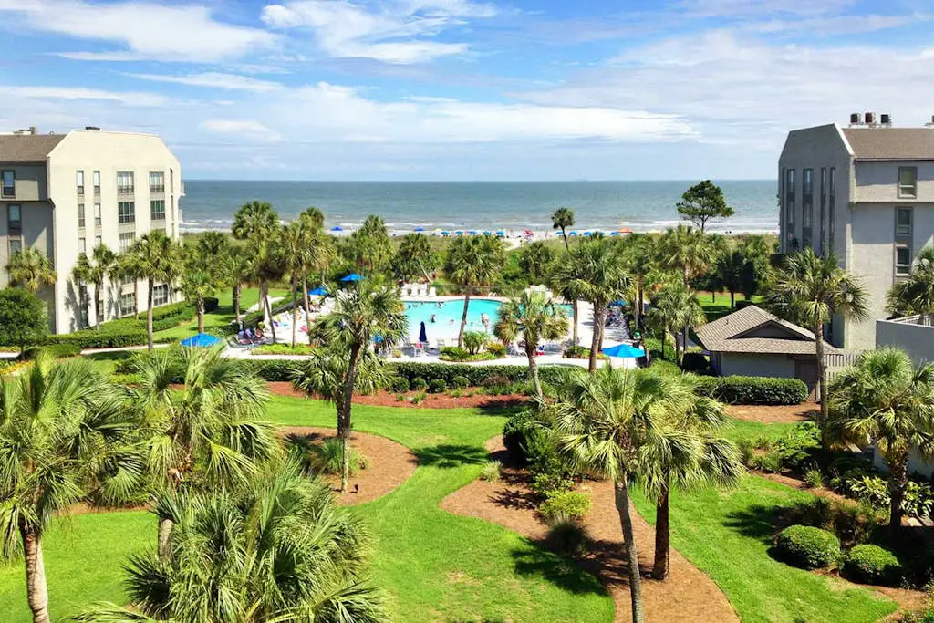 Updated beach gem with ocean views, pool, hot tub, & tennis - snowbird-friendly