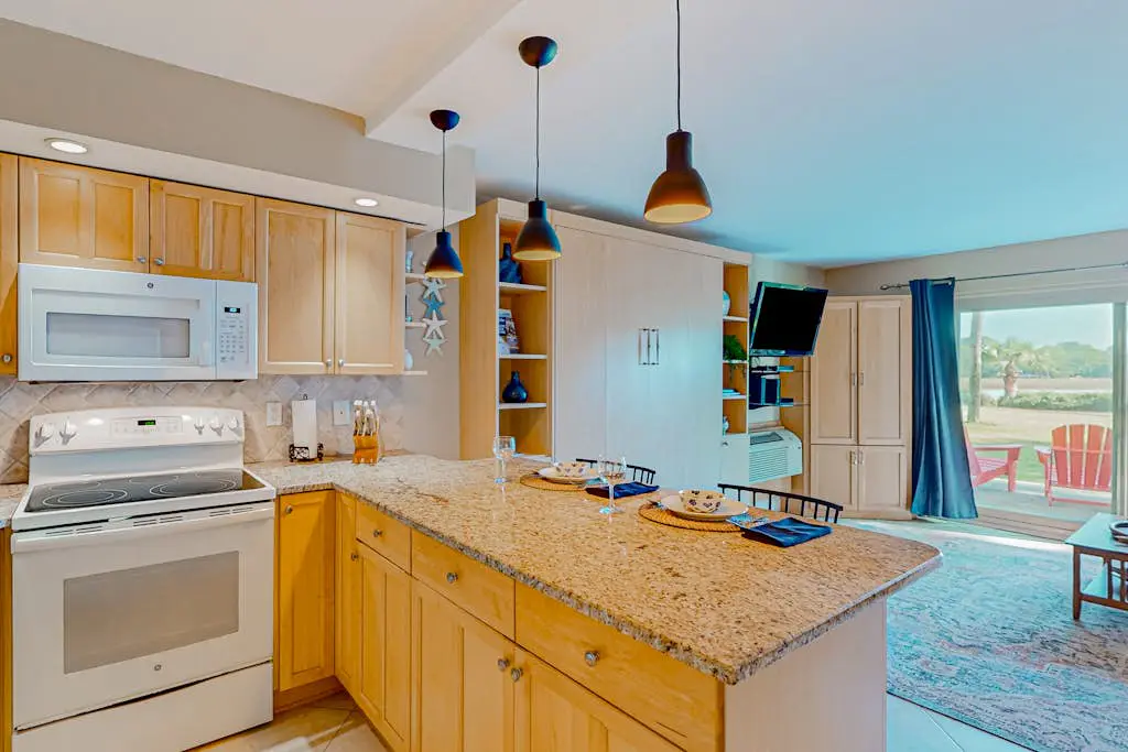 Charming Ground Floor studio condo near beach with tennis, pickleball, & water views