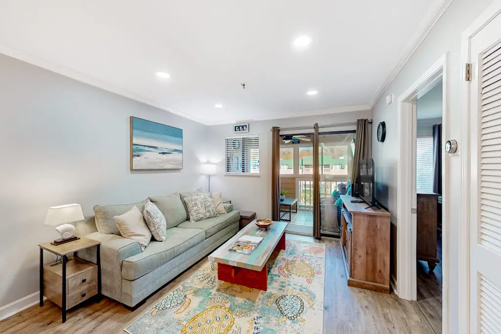 Waterfront villa with resort amenities, beach access, open layout, AC, & W/D