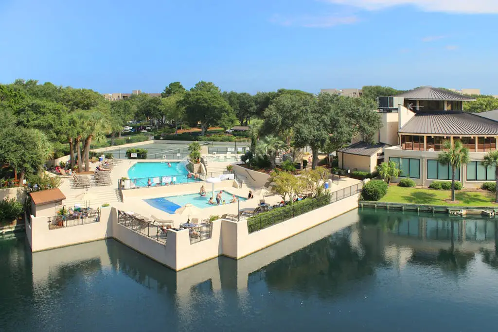 Spacious villa with pool, hot tub, playground & cute decor - steps from beach
