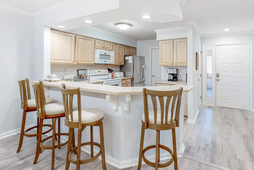 Water/golf course-view condo with private deck, on-site pool & hot tub
