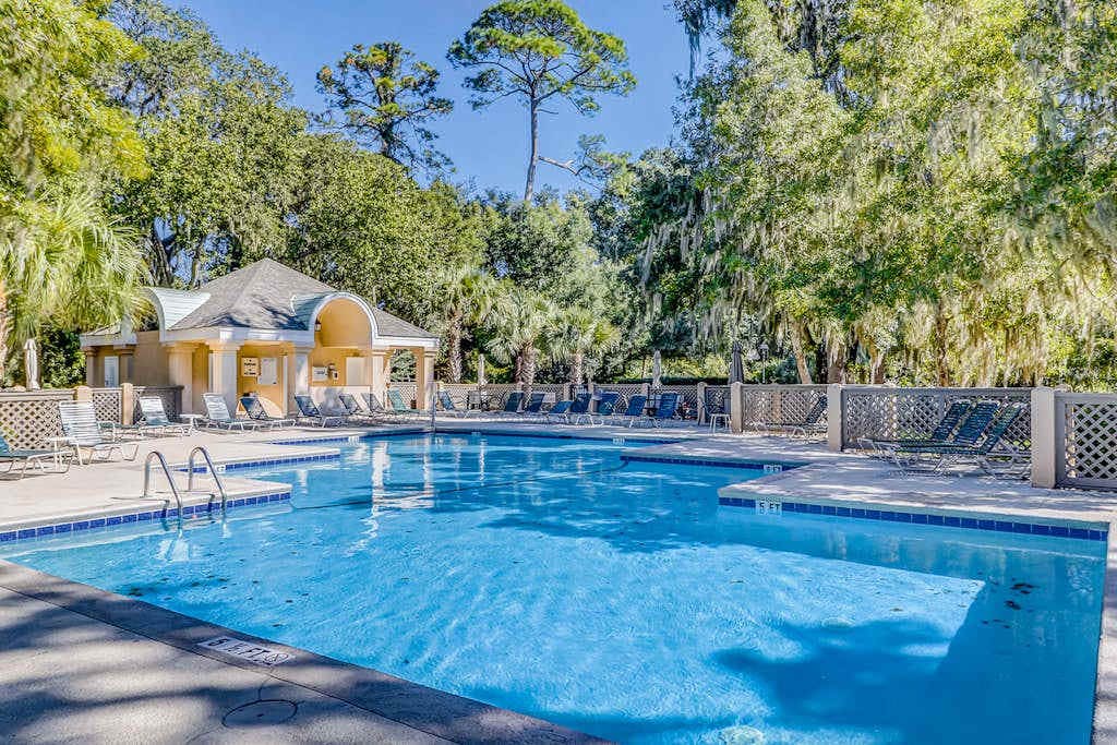 Water/golf course-view condo with private deck, on-site pool & hot tub