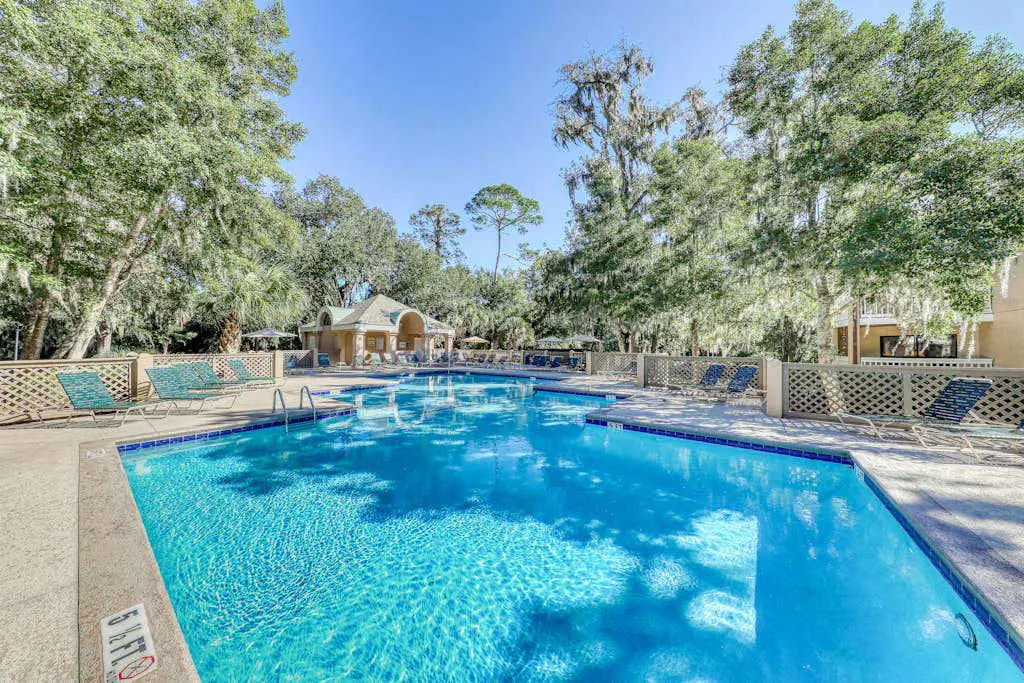 Water/golf course-view condo with private deck, on-site pool & hot tub