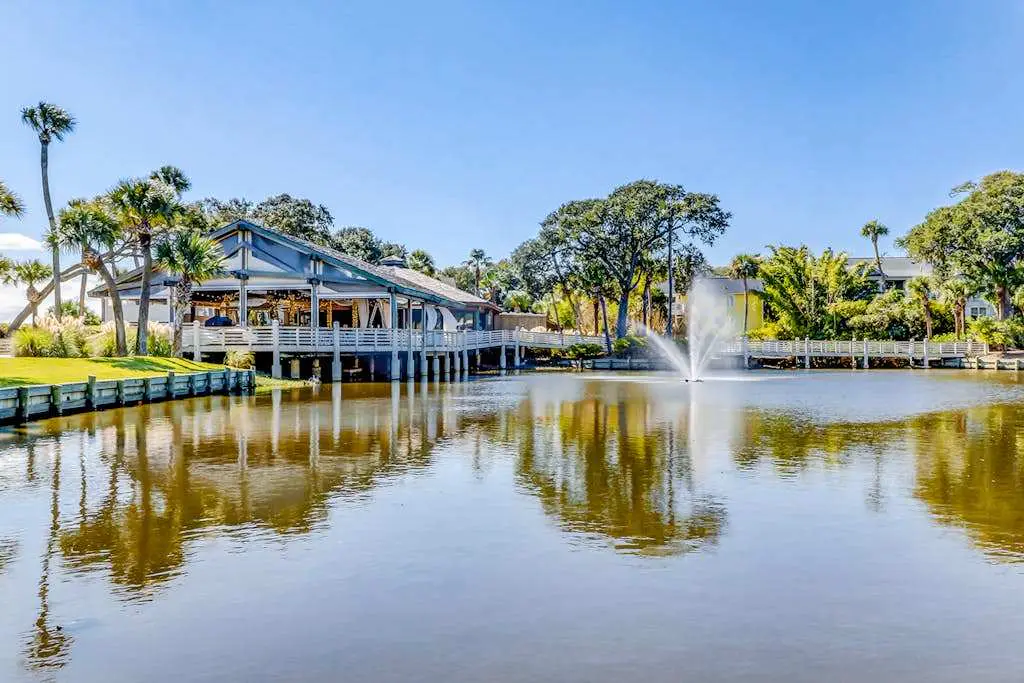 Water/golf course-view condo with private deck, on-site pool & hot tub